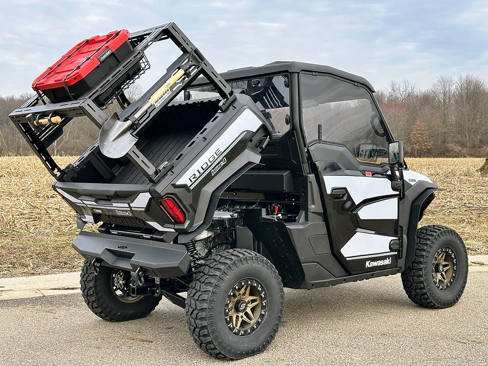 SCM bed rack for Kawasaki Ridge 3-seat and Ridge Crew: loaded bed rack on a Kawasaki Ridge, rear corner view outdoors