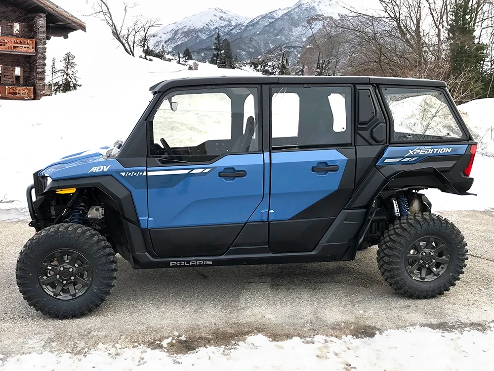 SCM door kit for Polaris Xpedition XP 5 and ADV 5: upper doors on a blue Polaris Xpedition, side view in snow