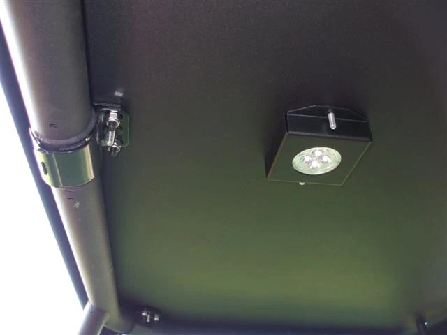 Close-up of the Extreme Metal Products hard top underside with the LED dome light and roll bar clamp