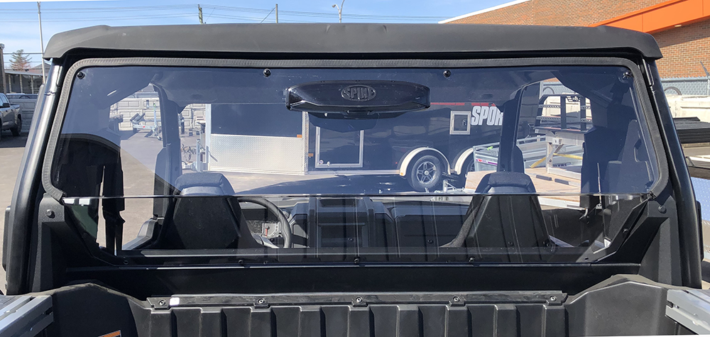 Spike rear windshield for Polaris Xpedition XP: vented rear windshield seen over the bed, rear view