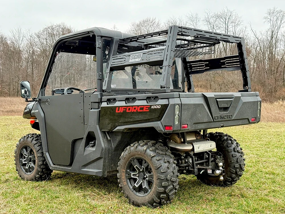 SCM bed rack for CF Moto UForce 1000 and UForce 1000 XL: bed rack on a black CFMOTO UForce, rear corner outdoors