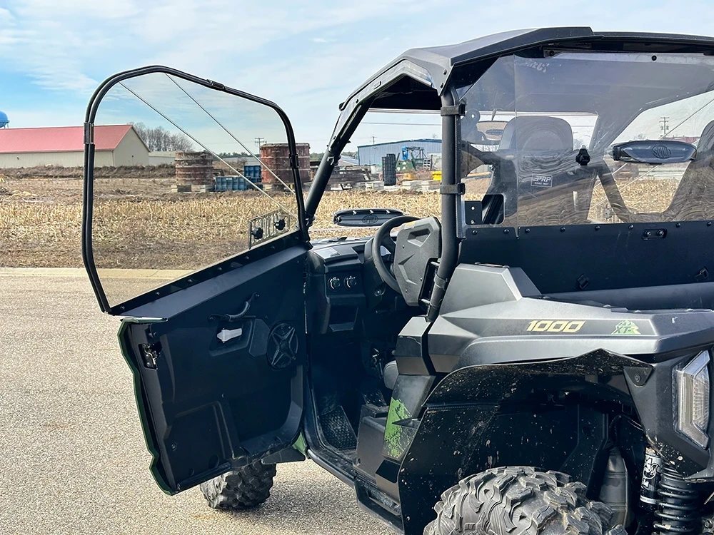 SCM door kit for Yamaha Wolverine RMAX2 1000 and X2 850: open upper door on a grey UTV, side view outdoors