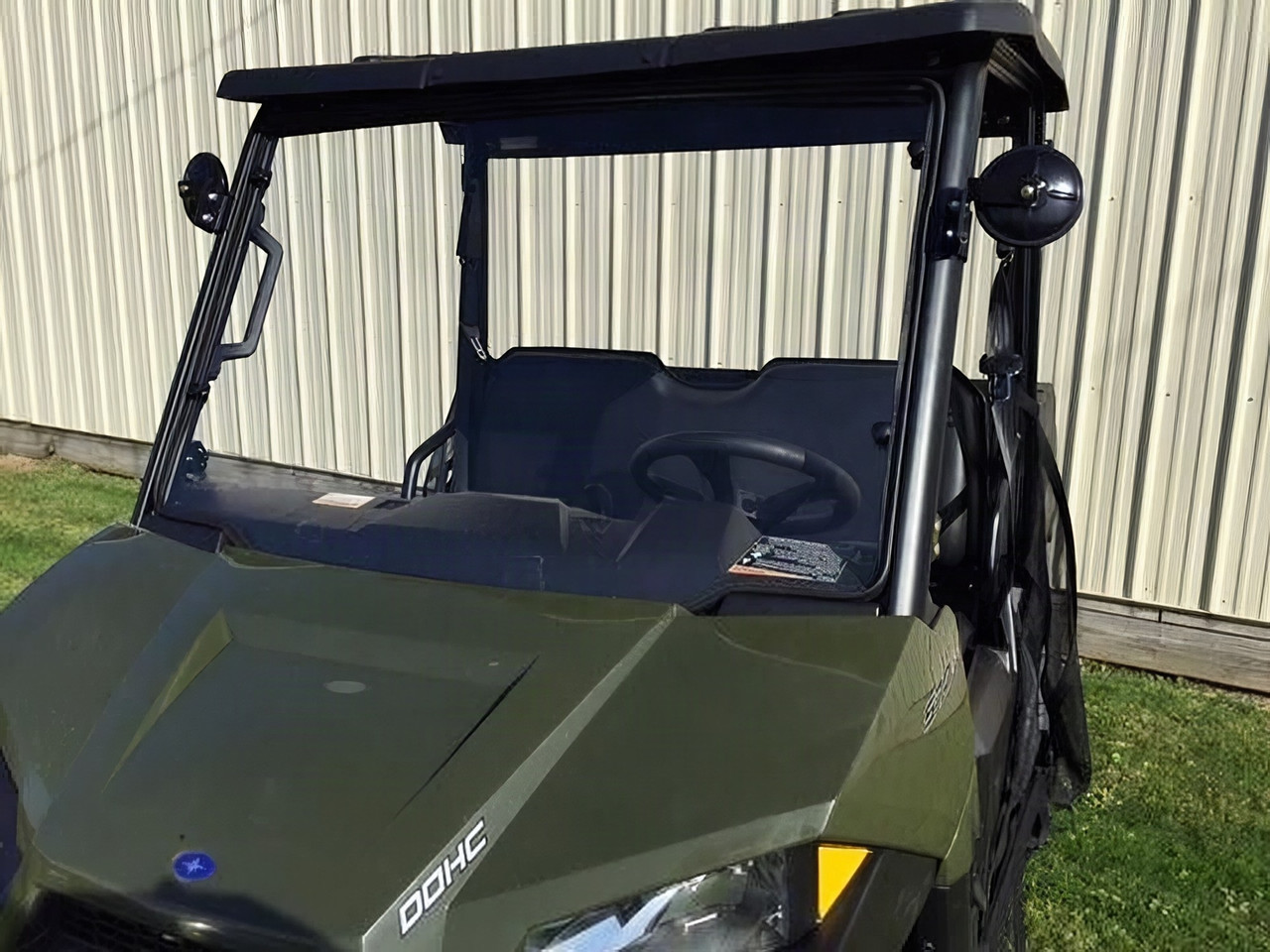 Extreme Metal Products full windshield installed on a green Polaris Ranger 570 mid size, front three-quarter view