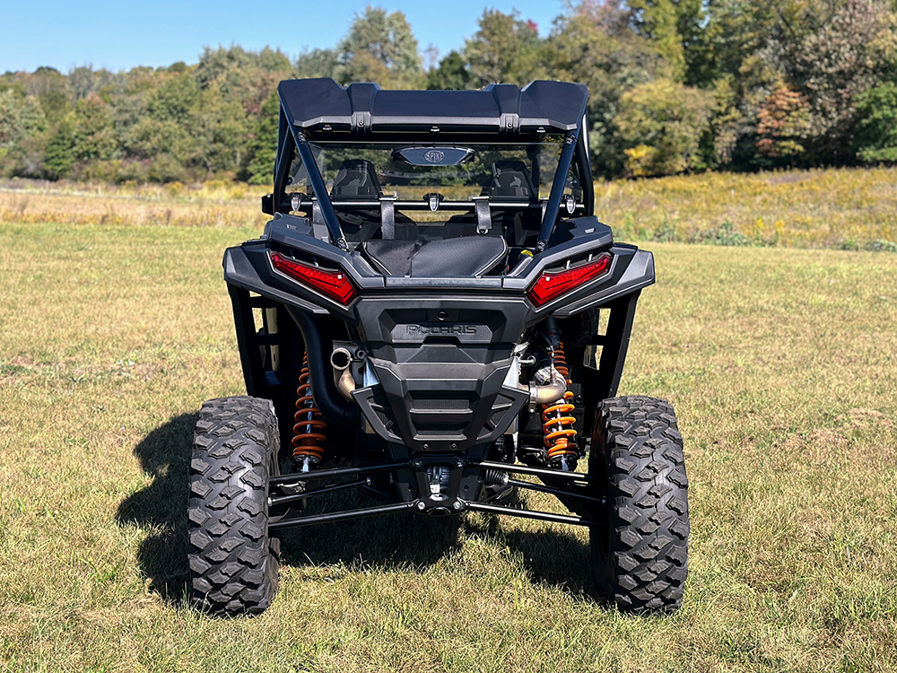 Spike rear windshield for Polaris RZR XP 1000 and XP 4 1000: rear windshield on a black Polaris RZR, straight rear view