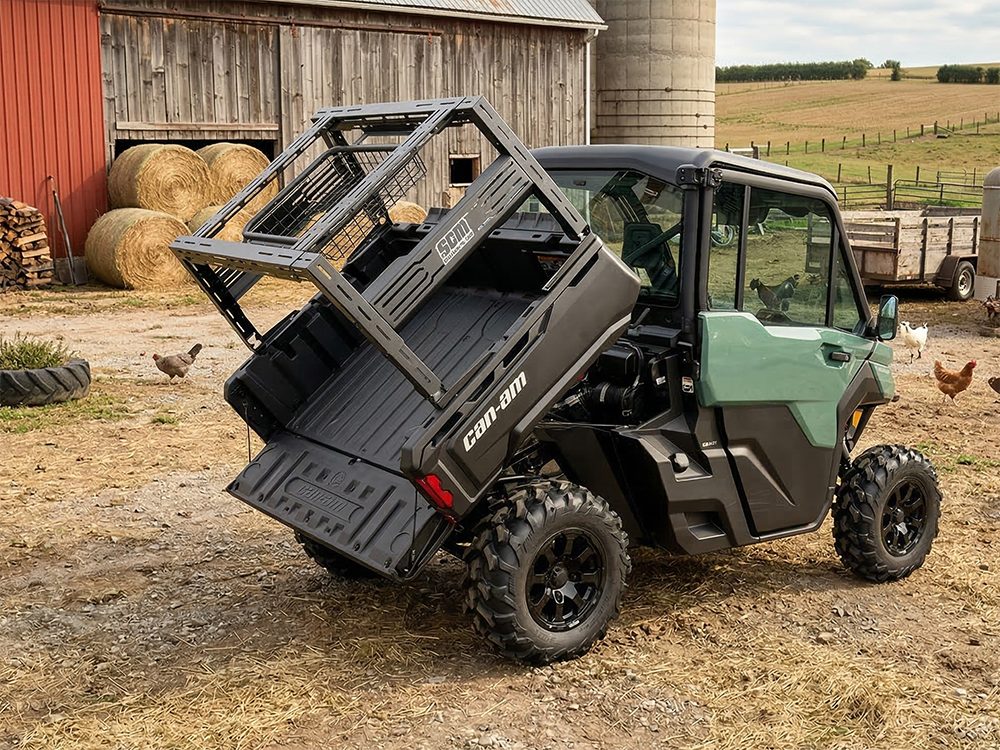 SCM bed rack for Can-Am Defender and Defender MAX: bed rack on a Can-Am Defender with the bed tilted up, farmyard