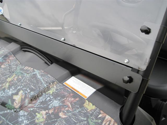 Close-up of the Extreme Metal Products windshield lower edge and hood clamp on the camo Polaris Ranger mid size