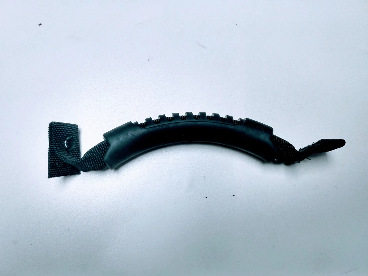 Spike replacement part for Polaris General with Spike 58-1600 upper doors: black rubber door pull handle on white background