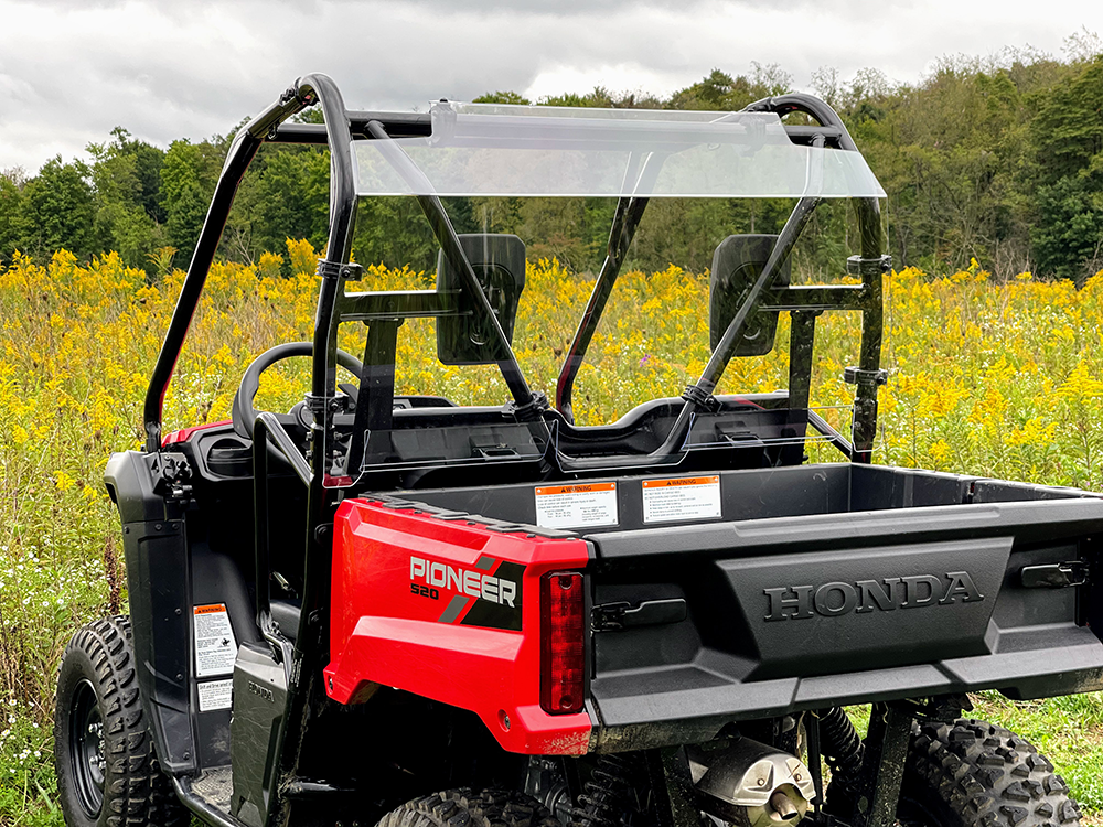 Spike rear windshield for Honda Pioneer 520 and Pioneer 500: rear windshield on a red Honda Pioneer, straight rear view