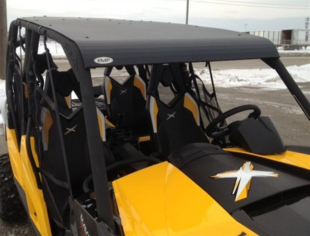 Extreme Metal Products black aluminum top installed on a yellow Can-Am Maverick Max, front angle from above in snow