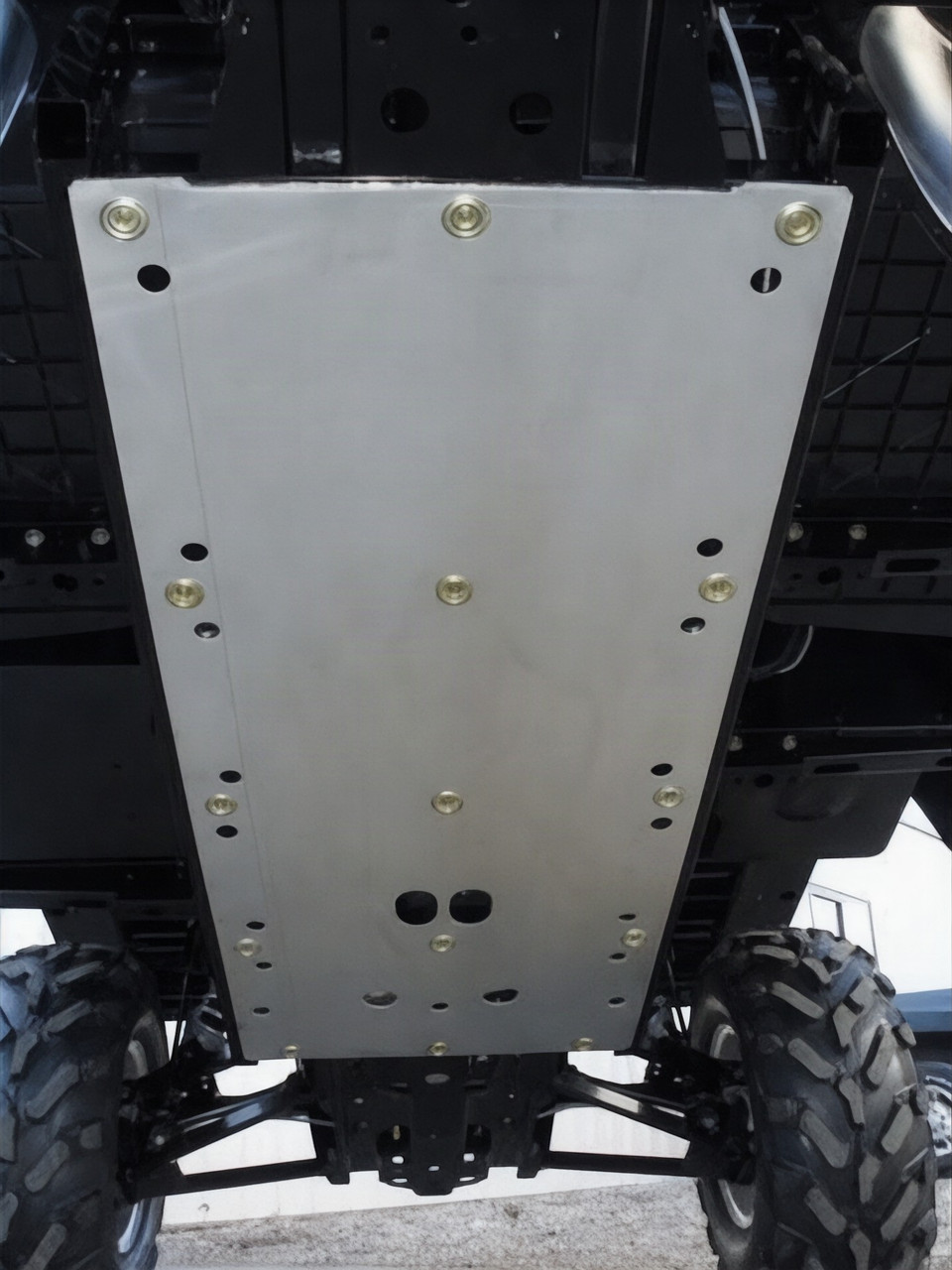 Extreme Metal Products bare aluminum full skid plate bolted under a Polaris Ranger 500/800, viewed from below the chassis