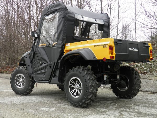 Rear three-quarter view of a yellow Cub Cadet Challenger showing the 3 Star rear window panel and soft doors