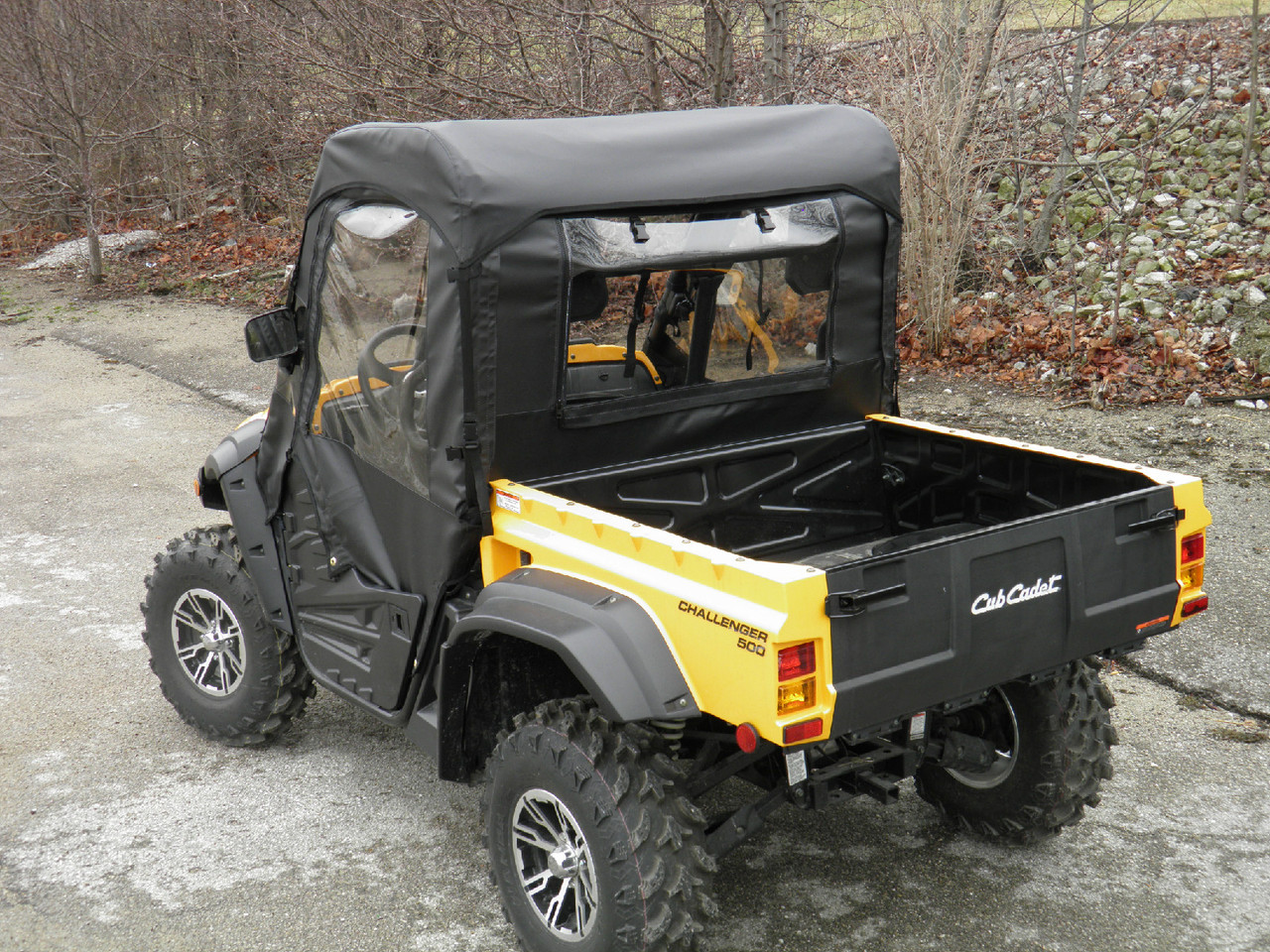 Rear three-quarter view from the passenger side of the 3 Star cab enclosure and cargo bed on the Cub Cadet Challenger