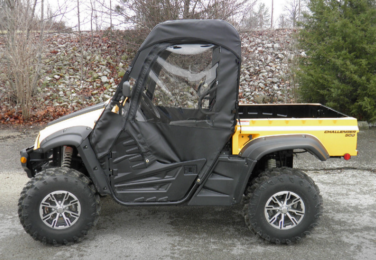 3 Star full cab enclosure with vinyl windshield on a yellow Cub Cadet Challenger 500, side profile view