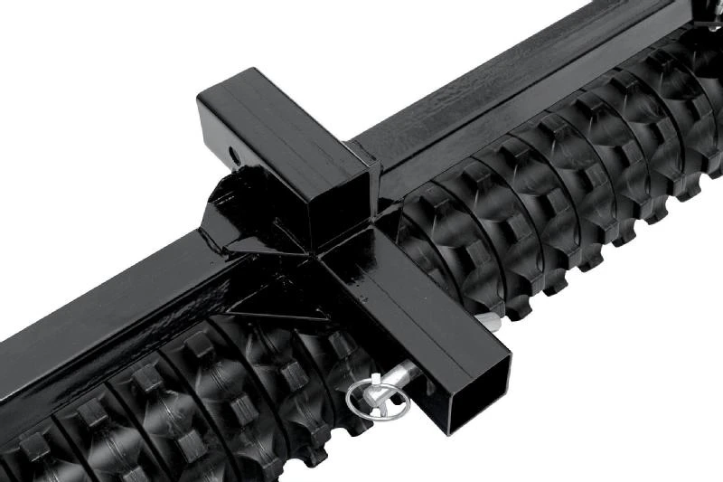 Close-up of the Moto Alliance Impact Implements culti-packer hitch receiver and pin above the roller