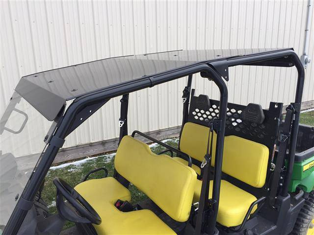 Side view of the John Deere Gator XUV S4 showing the Extreme Metal Products hard top over both rows of yellow seats