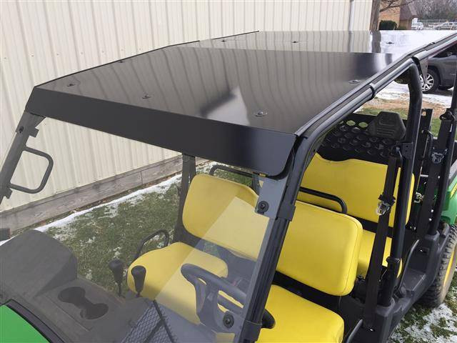 Extreme Metal Products black hard top installed on a John Deere Gator XUV S4 with yellow seats, front three-quarter view