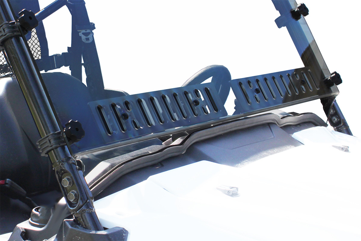 Close-up of the Spike Powersports dual vent panel at the base of the Honda Pioneer 1000 windshield