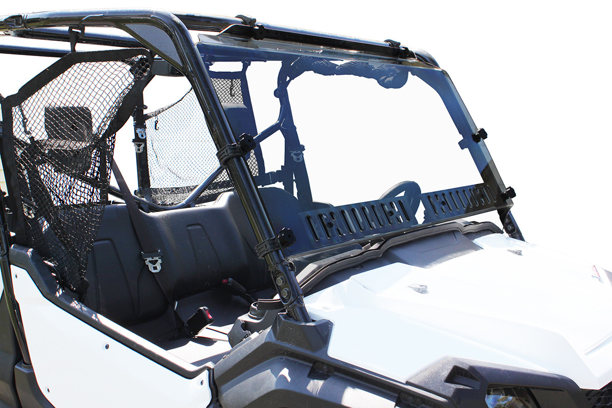 Front three-quarter view of a white Honda Pioneer 1000 with the Spike Powersports vented windshield