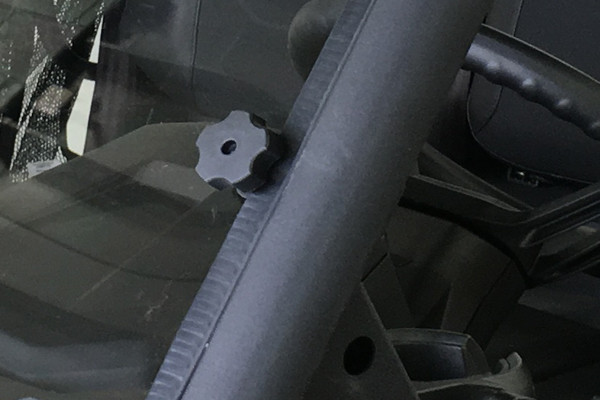 Spike windshield for Can-Am Defender and Defender MAX: close-up of the windshield mounting knob on the cage
