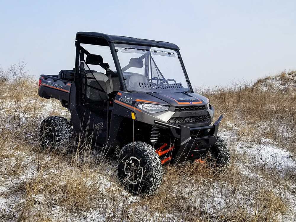 Spike windshield for Polaris full-size Ranger: multi-vent windshield on a Polaris Ranger in a snowy field
