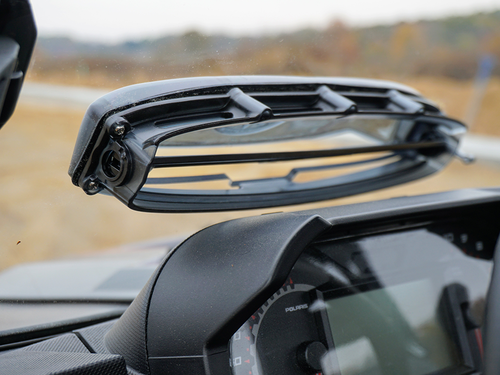 Inside close-up of a Spike Powersports windshield vent flipped open above the Polaris Ranger gauge cluster
