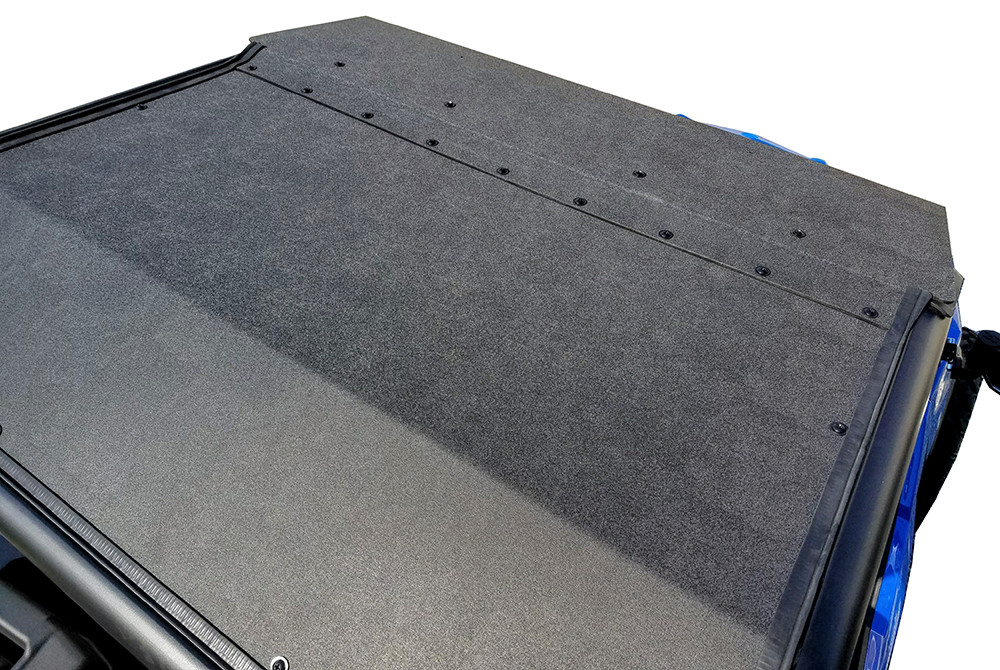 Top-down close-up of the textured black ABS roof surface and mounting bolts