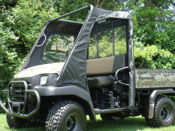 Front three-quarter view of the camo Kawasaki Mule 3010 with the 3 Star enclosure doors behind a hard windshield