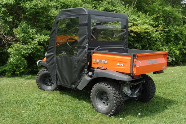Rear three-quarter view of the orange Kubota RTV with the 3 Star cab enclosure and rear window installed