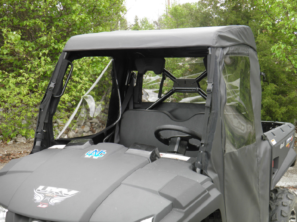 View over the hood of a Kymco 450i through the hard windshield at the 3 Star cab enclosure roof and side panels