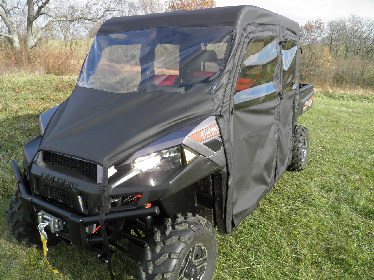 3 Star full cab enclosure with vinyl windshield on a black Polaris Ranger 900 Crew, front three-quarter view