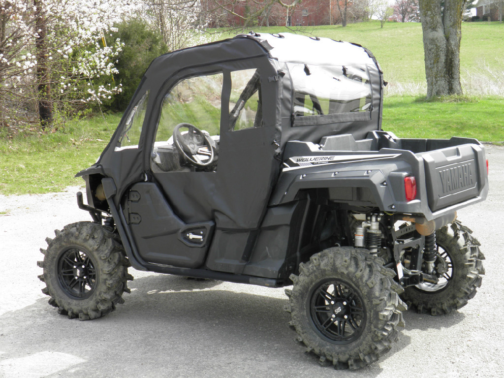 Driver side rear three-quarter view of the Yamaha Wolverine showing the 3 Star soft door and rear window
