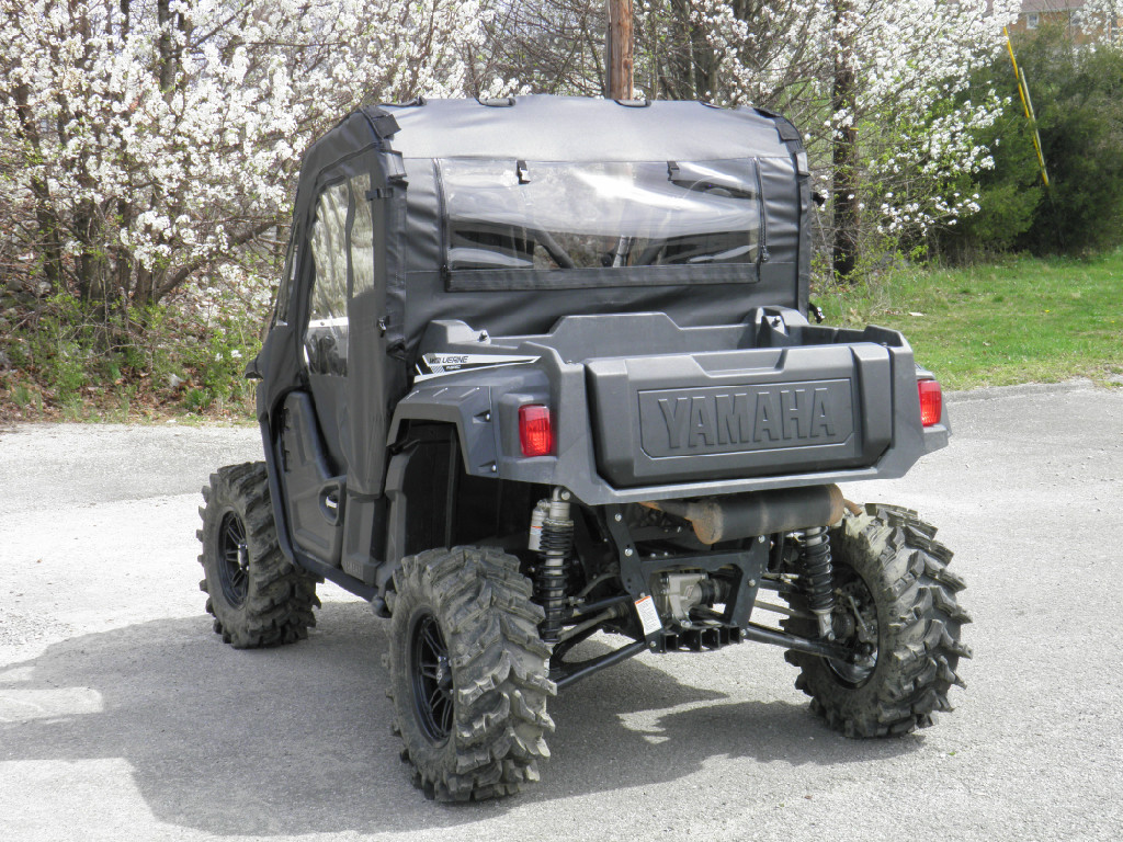 Rear view of the Yamaha Wolverine with the 3 Star enclosure rear window and top above the cargo bed
