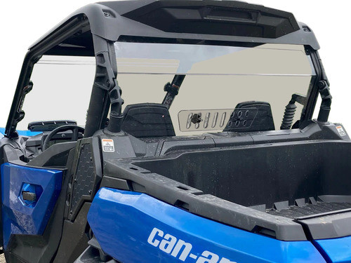 Spike Powersports tinted rear shield with slotted vent installed behind the seats of a blue Can-Am Maverick, rear angle view