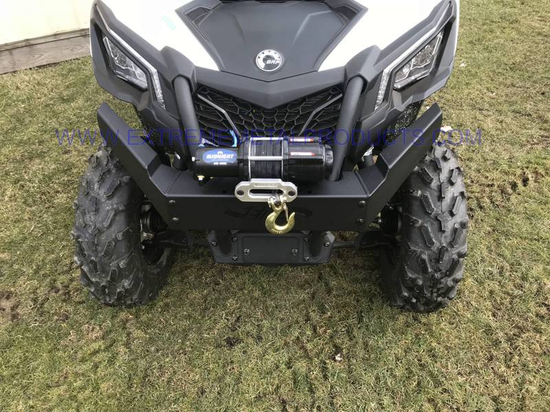 Extreme Metal Products black front brush guard with winch mounted on a white Can-Am Maverick Trail, straight-on front view