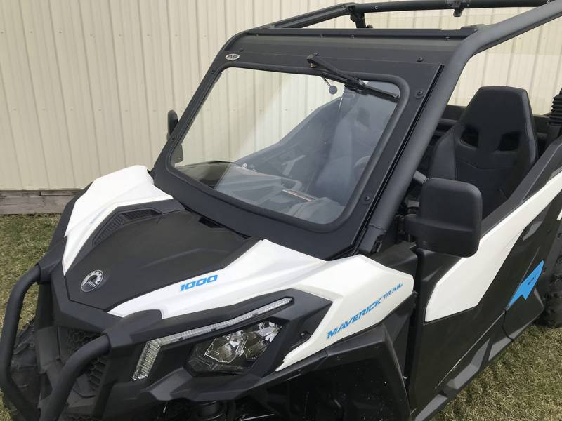 Extreme Metal Products laminated glass windshield with wiper on a white Can-Am Maverick Trail, front three-quarter view