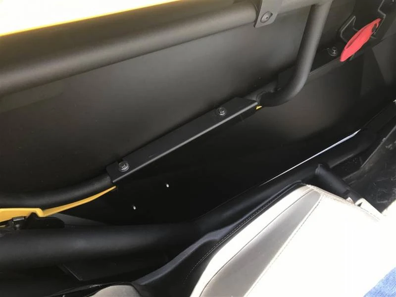Inside view of the Extreme Metal Products lower door bracket bolted to the Can-Am Maverick X3 door frame