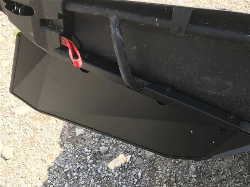 Underside view of the Extreme Metal Products lower door panel mounted on the Can-Am Maverick X3 over gravel