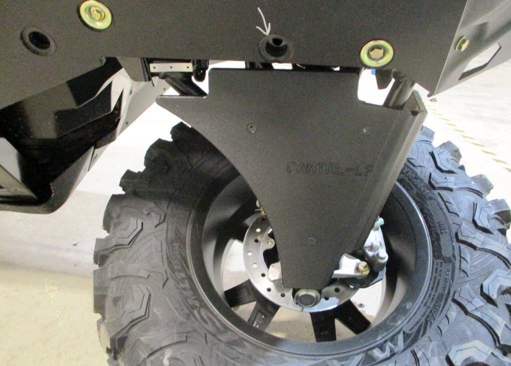 Underside view of a Trail Armor A-arm guard on the Can-Am Maverick Trail next to the brake rotor and tire