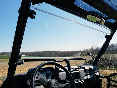 View from inside the Polaris Ranger XP1000 cab through the tilted open Spike Powersports windshield