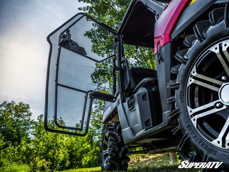 SuperATV cab door swung open on the Ranger Midsize showing the hinge side and tinted window, low angle