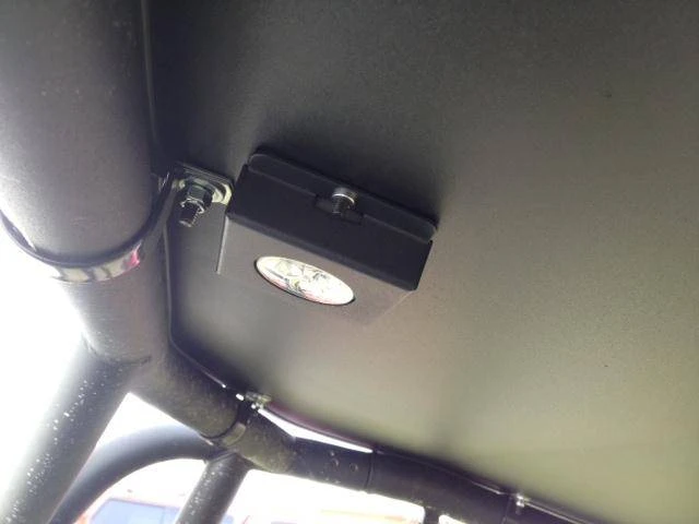 Underside close-up of the Extreme Metal Products aluminum top clamp bracket on the Maverick cage bar