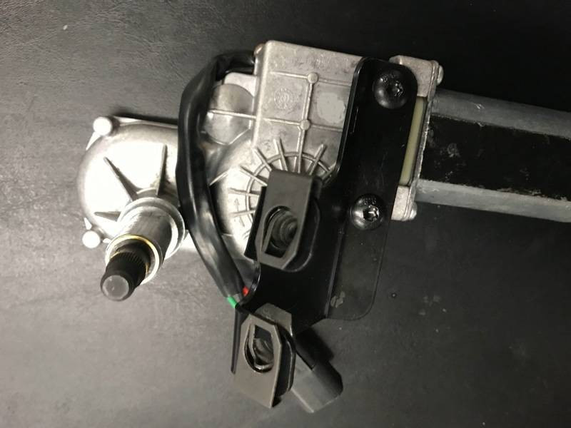 EMP electric wiper motor on its mounting bracket with the wire plug, close-up for a CanAm Maverick X3