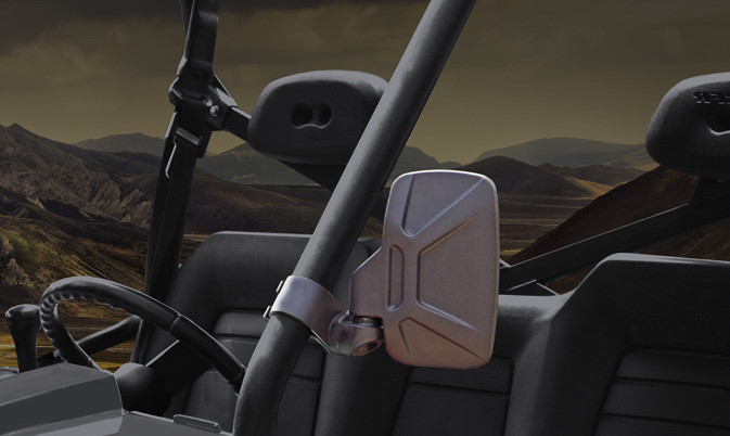 Seizmik side view mirror clamped to a 2-inch roll cage, rendered cab view with desert hills through the windshield