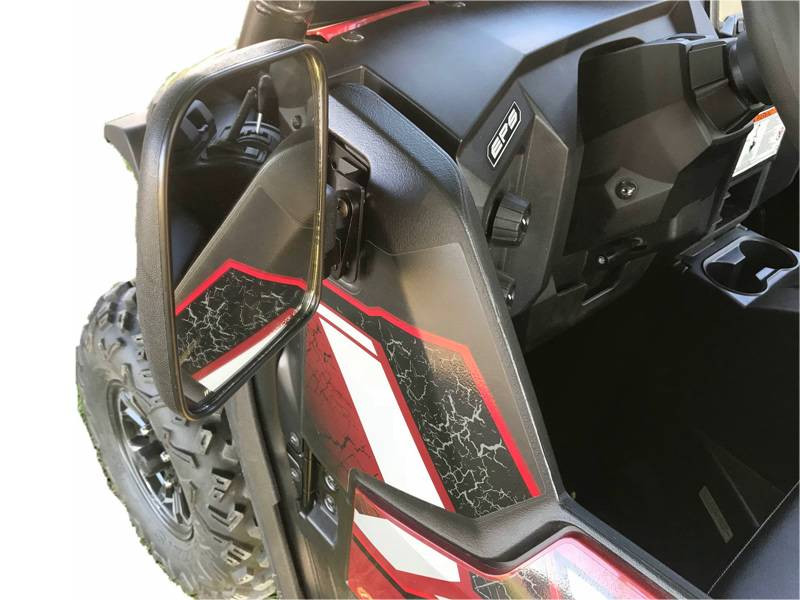 Extreme Metal Products folding mirror extended in the open position beside the dash of a red Yamaha Wolverine, front view