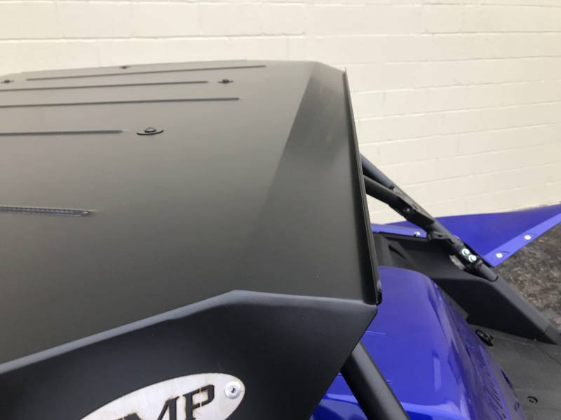 Close-up of the Extreme Metal Products aluminum top edge and side lip over the blue Yamaha YXZ cage