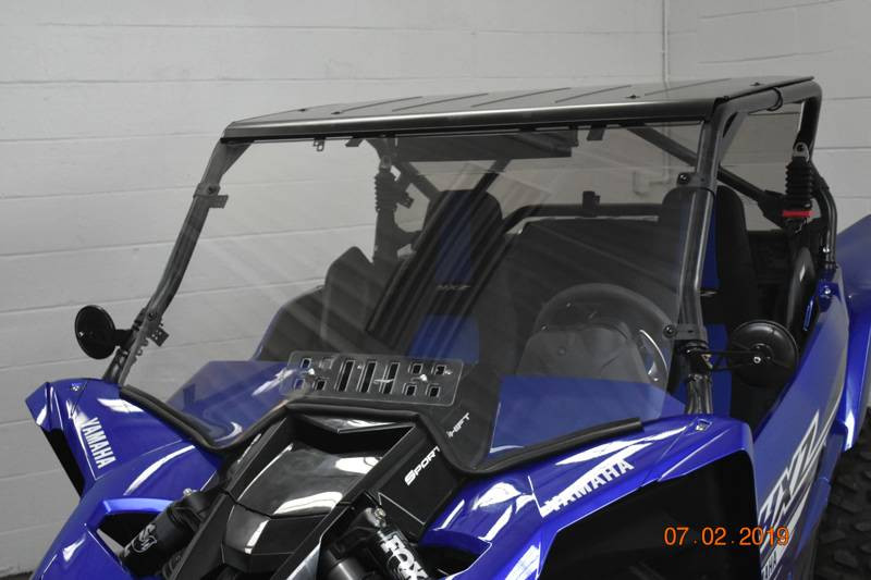 Extreme Metal Products polycarbonate windshield with slotted vent installed on a blue Yamaha YXZ, front three-quarter view