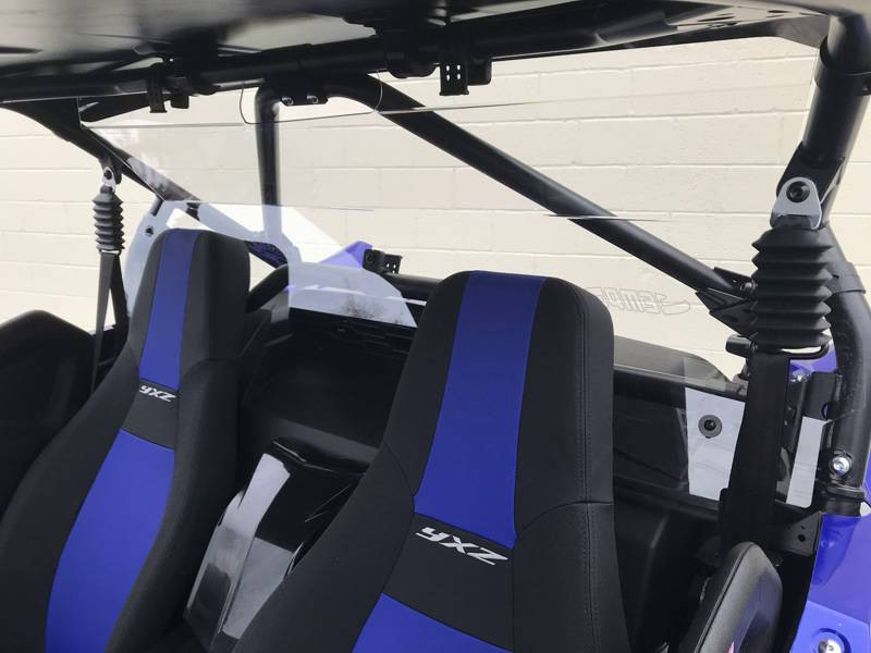 Extreme Metal Products clear rear panel on a Yamaha YXZ, angled view from the passenger side behind the blue seats