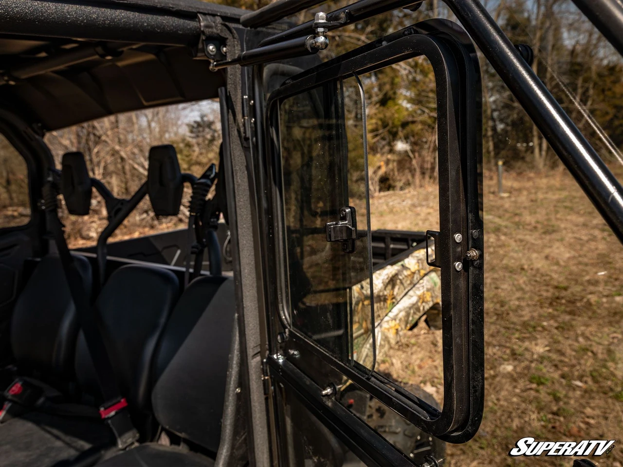 Inside the Yamaha Viking cab showing the SuperATV hard door with its sliding window open and rear seats