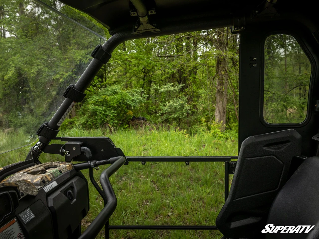 View from the front seat of the Yamaha Viking looking back at the rear seats and SuperATV door windows