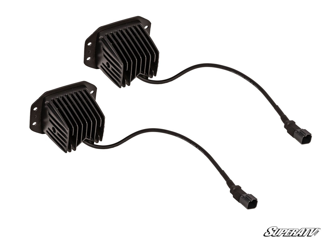 Rear view of two SuperATV recessed cube lights showing heat sink fins and wiring pigtails with connectors